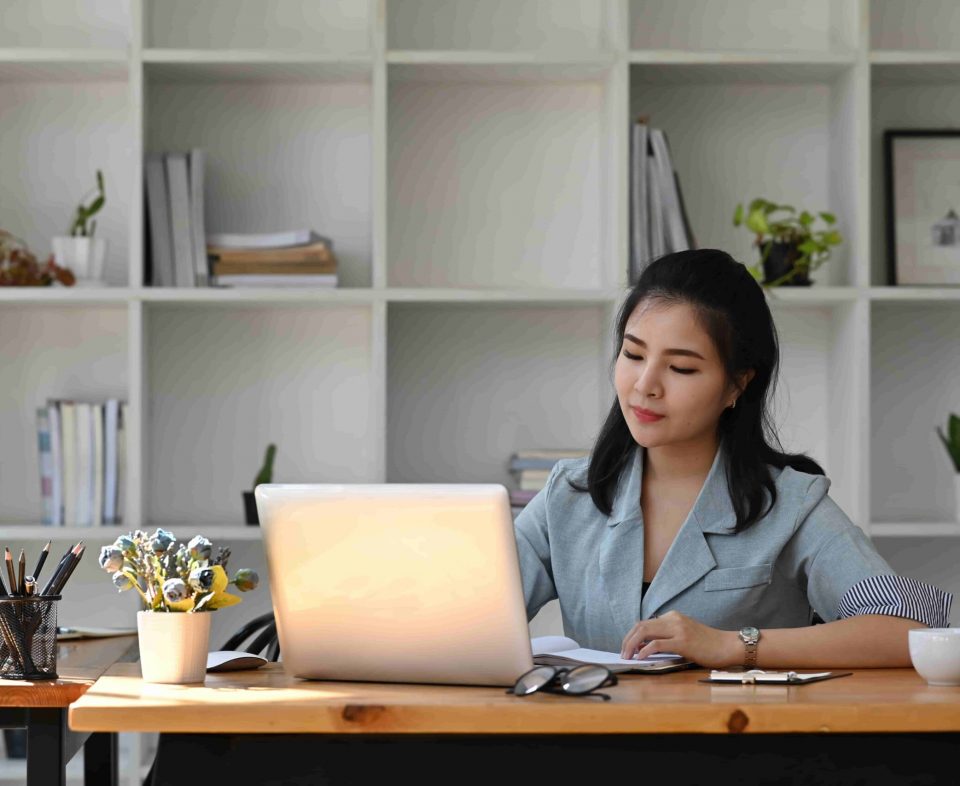 asian-business-woman-using-laptop-computer-at-offi-2022-03-29-08-47-43-utc-min